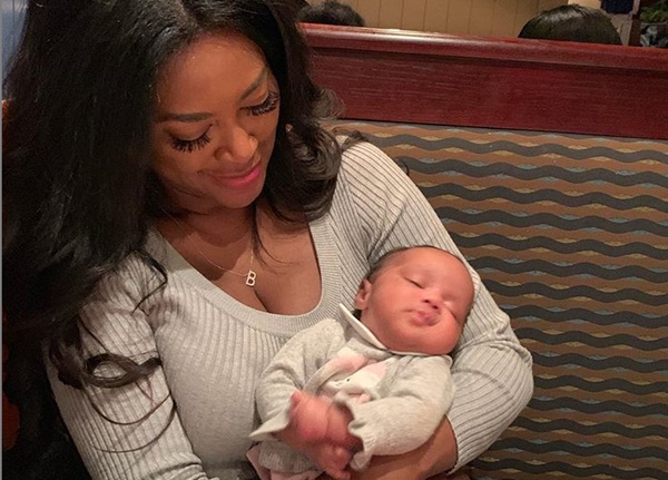 Kenya Moore First Moments Holding Baby Brooklyn